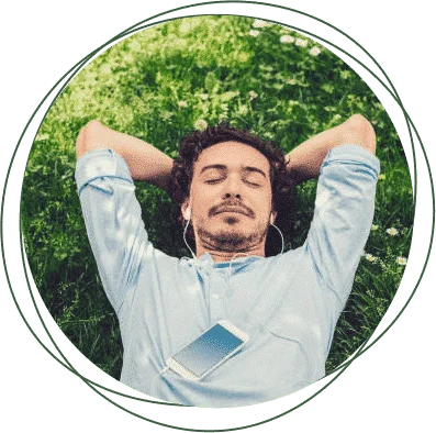 man lying down with his hands on the back of his head with a headset